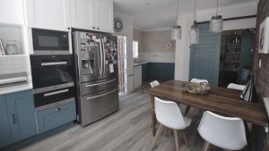 Cottage style dusty blue kitchen design.